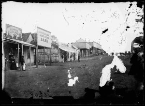 Herbert Street (east side between Queen & Mayne Streets looking south) showing Australian Joint Stock Bank, Gulgong 1870s